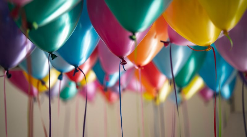 selective focus photography of assorted-color balloons