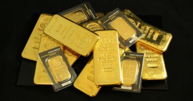 a pile of gold bars sitting on top of a table