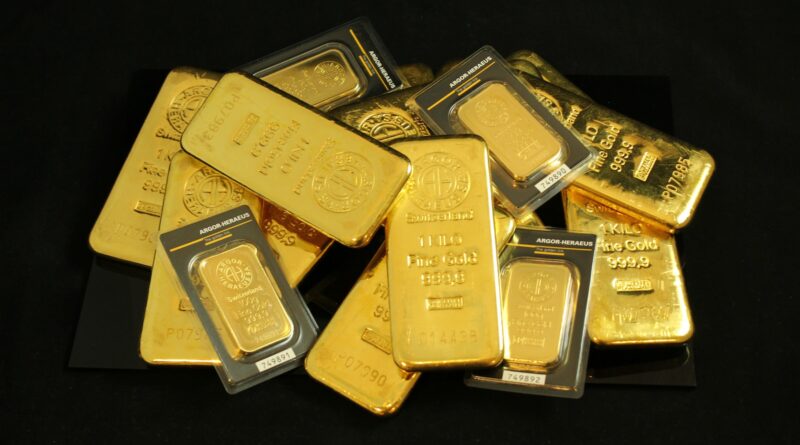 a pile of gold bars sitting on top of a table