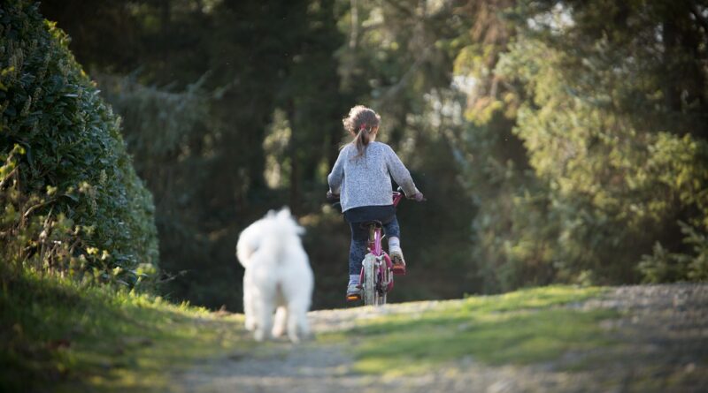 girl, biking, dog